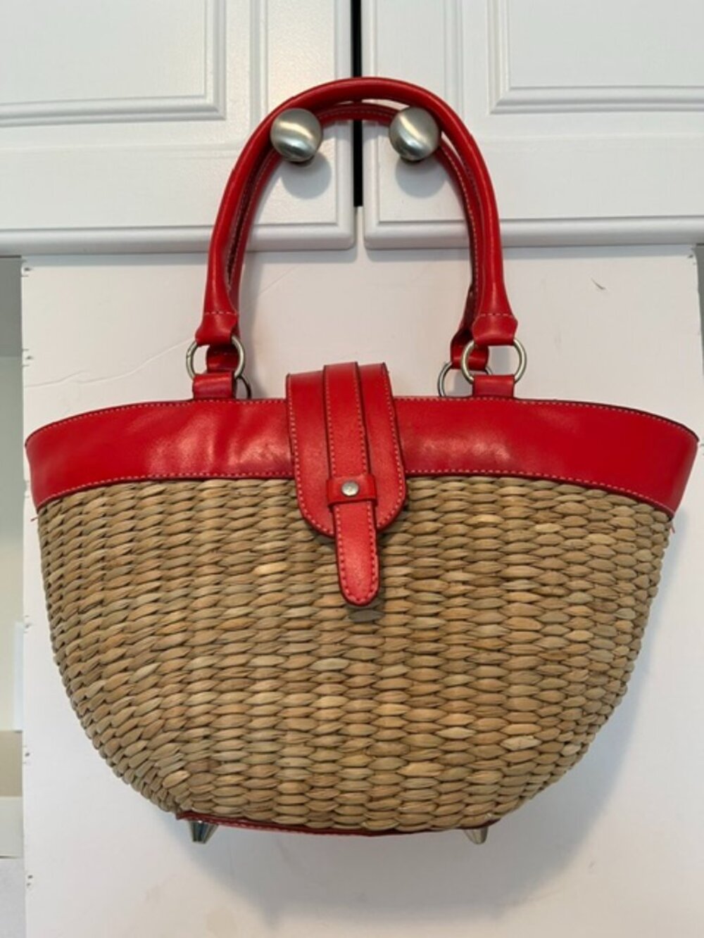 A. Giannetti straw and leather bag.